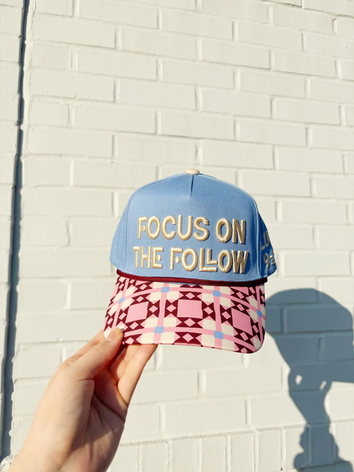 FOCUS ON THE FOLLOW HAT