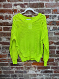 neon yellow-green open-knit long-sleeve sweater with a round neckline on a hanger