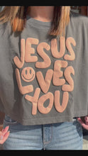Load and play video in Gallery viewer, SMILEY JESUS LOVES YOU PUFF CAP SLEEVE TEE
